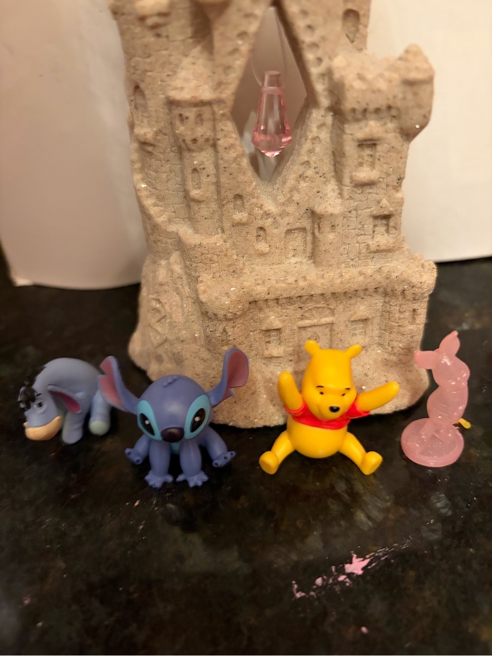 Sand castle and Disney figurines